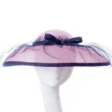 Pale Pink Sinamay Hat with Black Tulle Overlay.